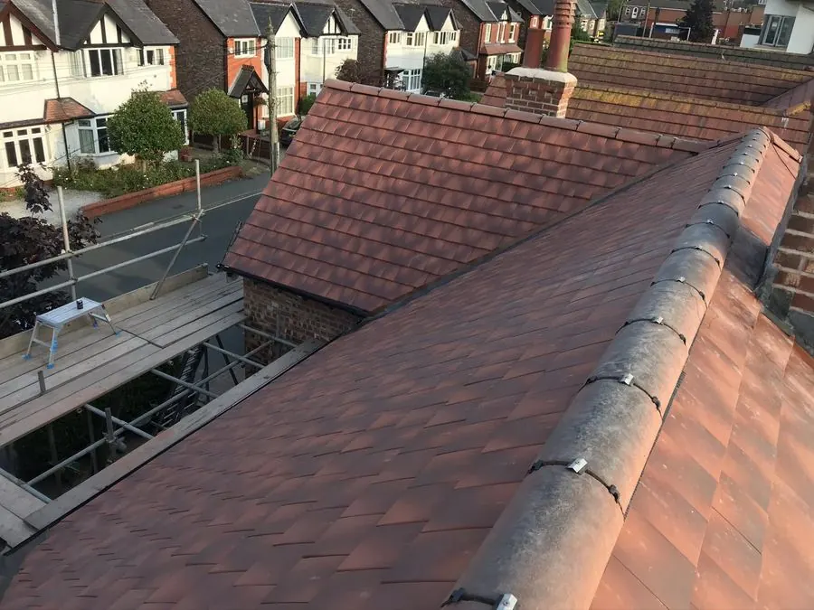 Roof with scaffolding during a re-roofing project